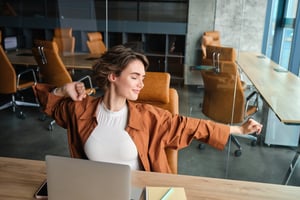 Back-to-work 2025 illustration – woman stretching in professional environment